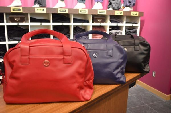 Lululemon urban sanctuary bags in deepest cranberry, nightfall, and black