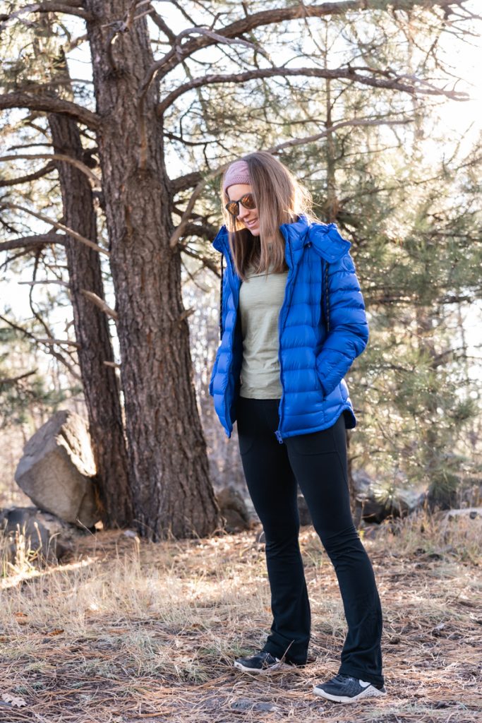 Winter athleisure outfit: flared leggings and cobalt blue down jacket